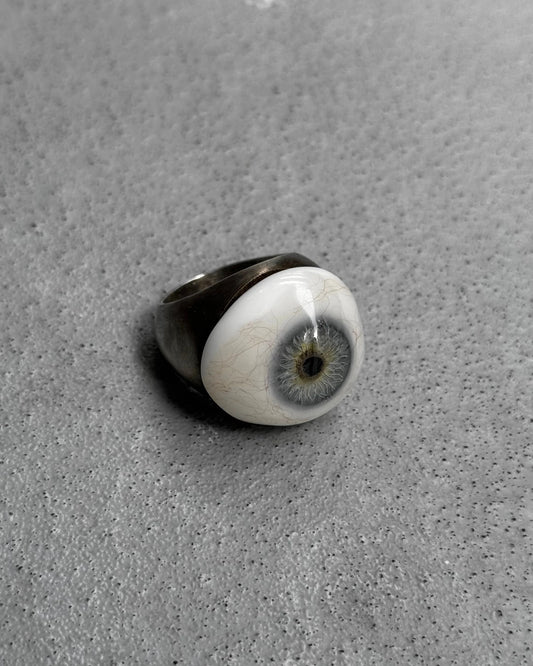 Ring with a unique design on a gray surface