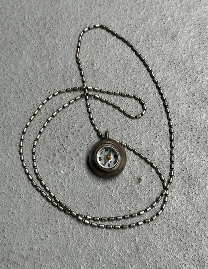 Necklace with a pendant on a textured surface