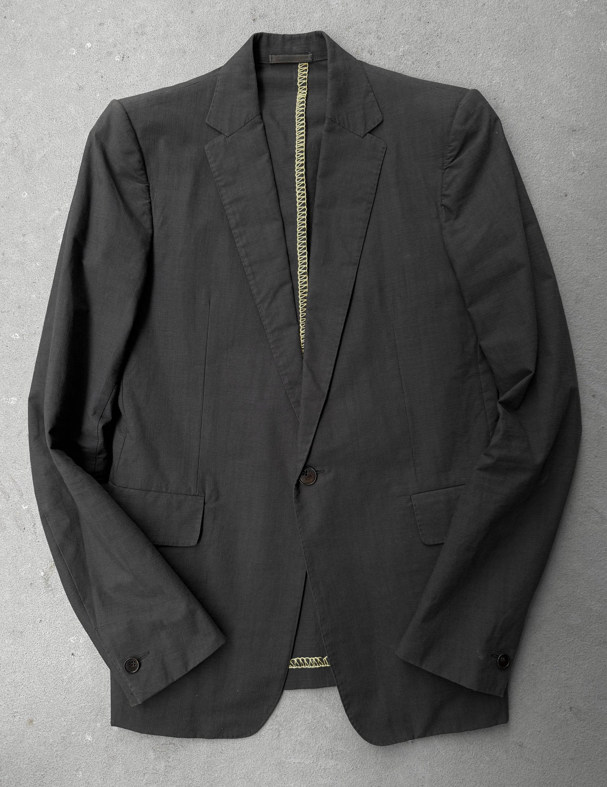 Black blazer on a gray surface