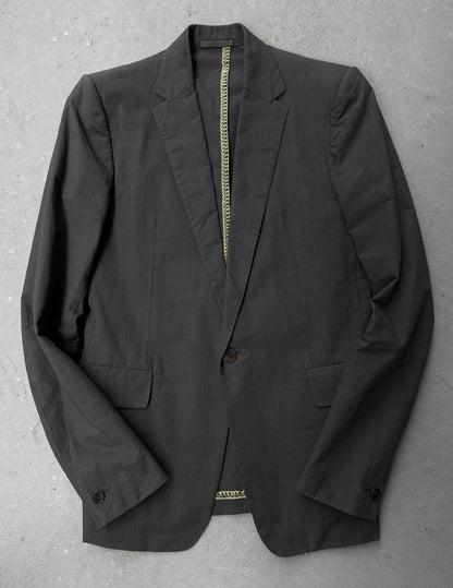 Black blazer on a gray surface