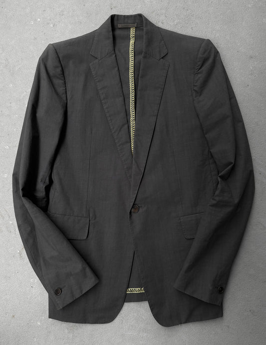 Black blazer on a gray surface