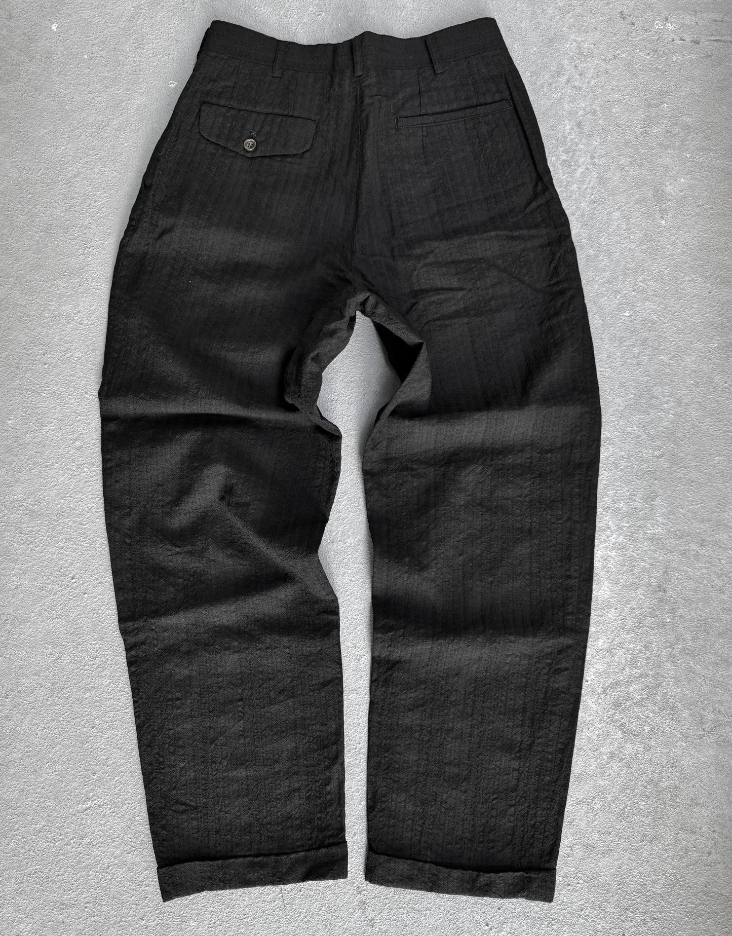 Black pants on a gray background