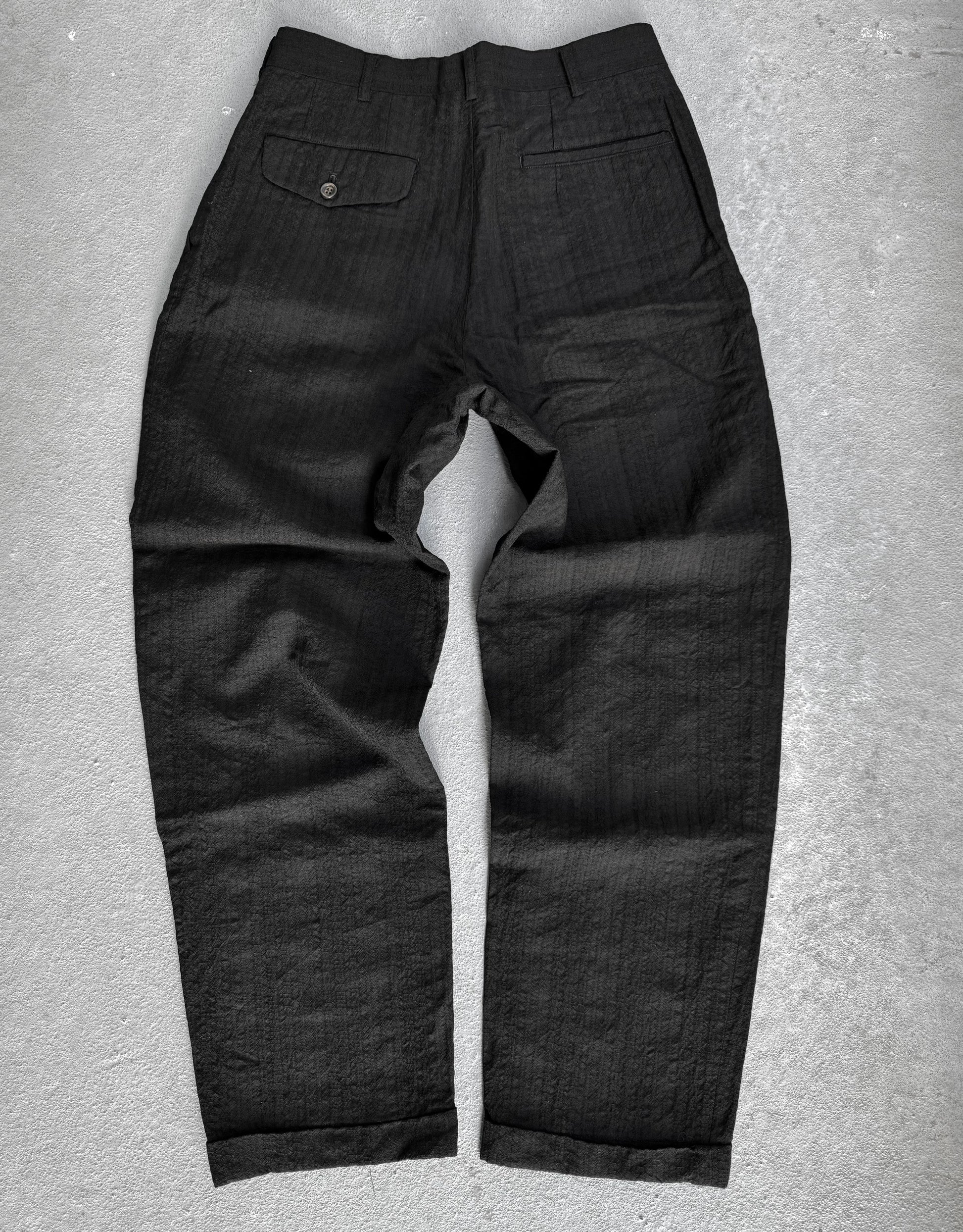 Black pants on a gray background