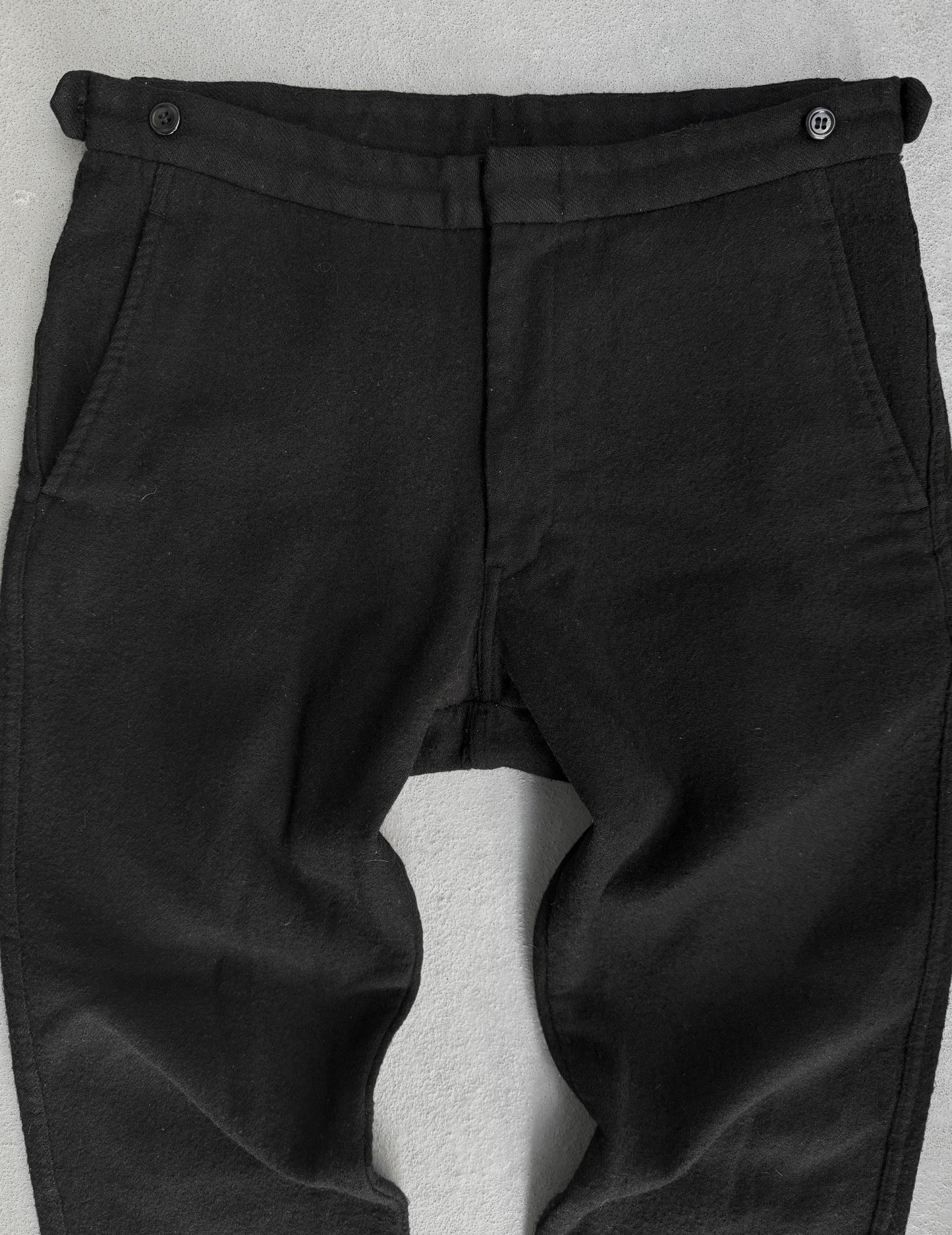 Black pants with a gray background