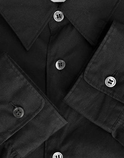 Close-up of a black jacket with button details