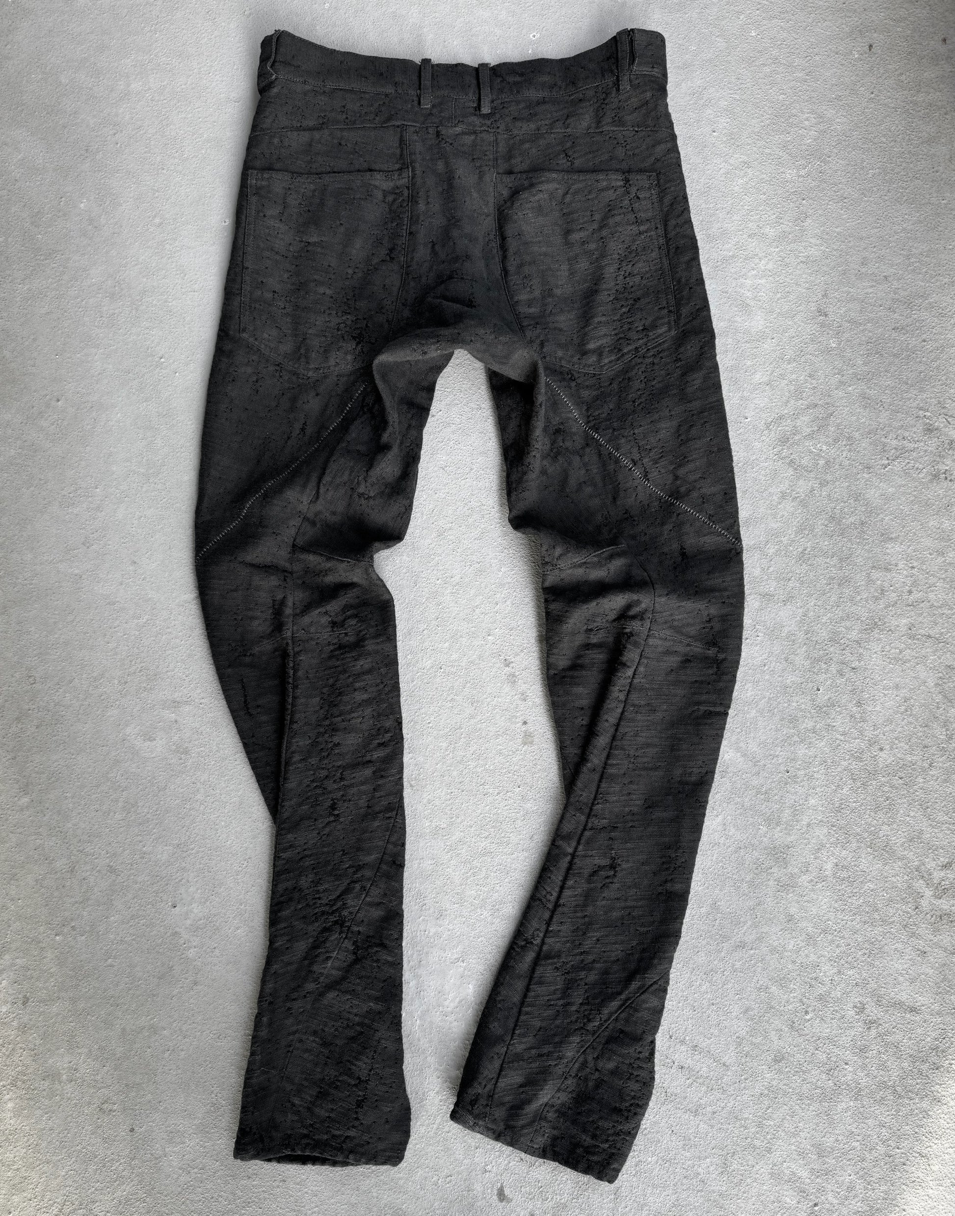 Dark gray pants on a light gray background