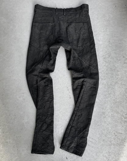 Dark gray pants on a light gray background