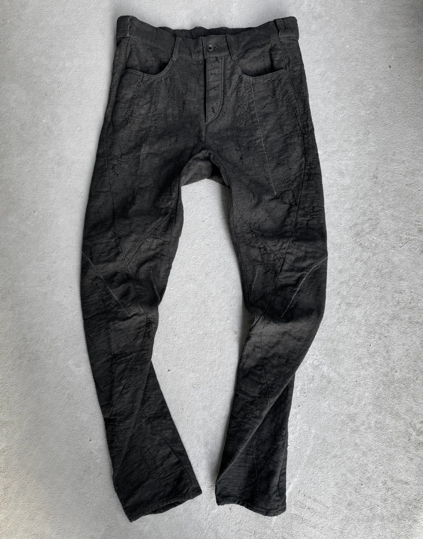 Dark gray pants on a light gray background