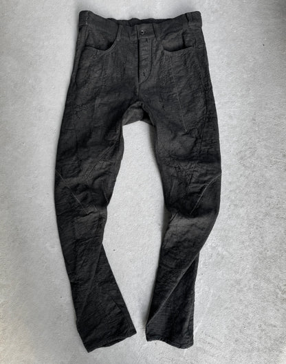Dark gray pants on a light gray background