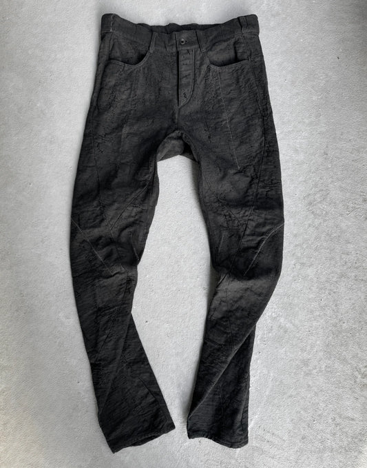 Dark gray pants on a light gray background
