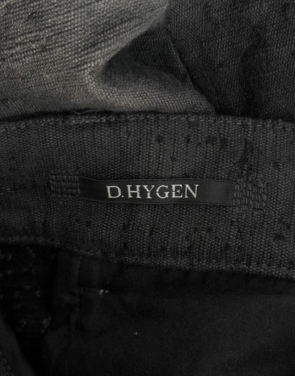 Close-up of a black fabric with 'D. Hygen' label
