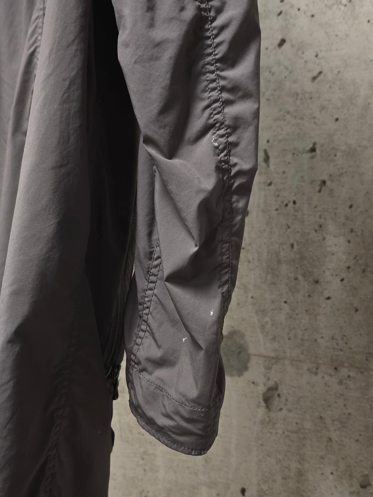 Julius_7 SS08 “Insanity In Industrial Inc.” Grey Hooded Poly Dual Zip Cargo Jacket