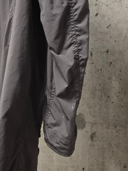 Julius_7 SS08 “Insanity In Industrial Inc.” Grey Hooded Poly Dual Zip Cargo Jacket