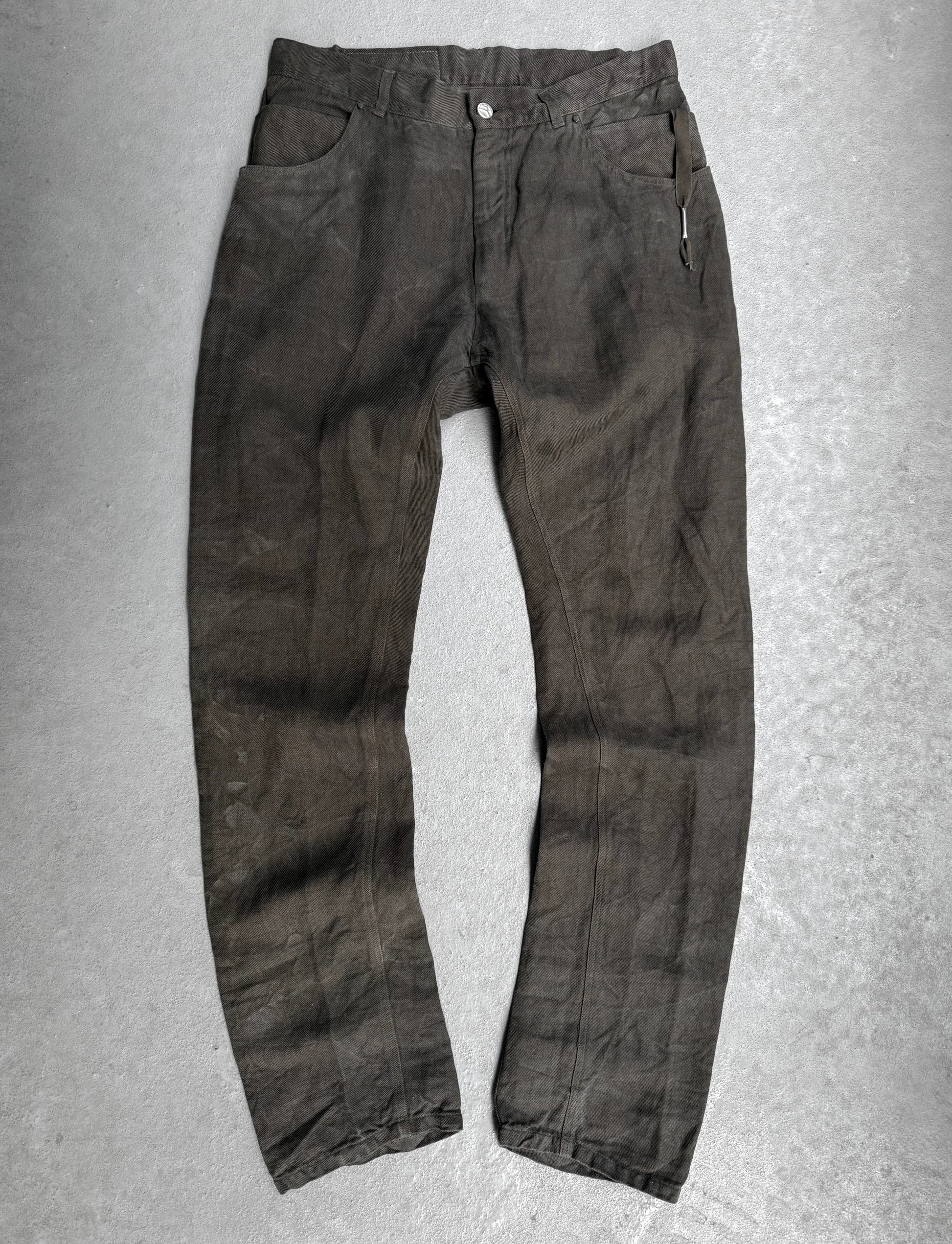 Dark brown pants on a gray background
