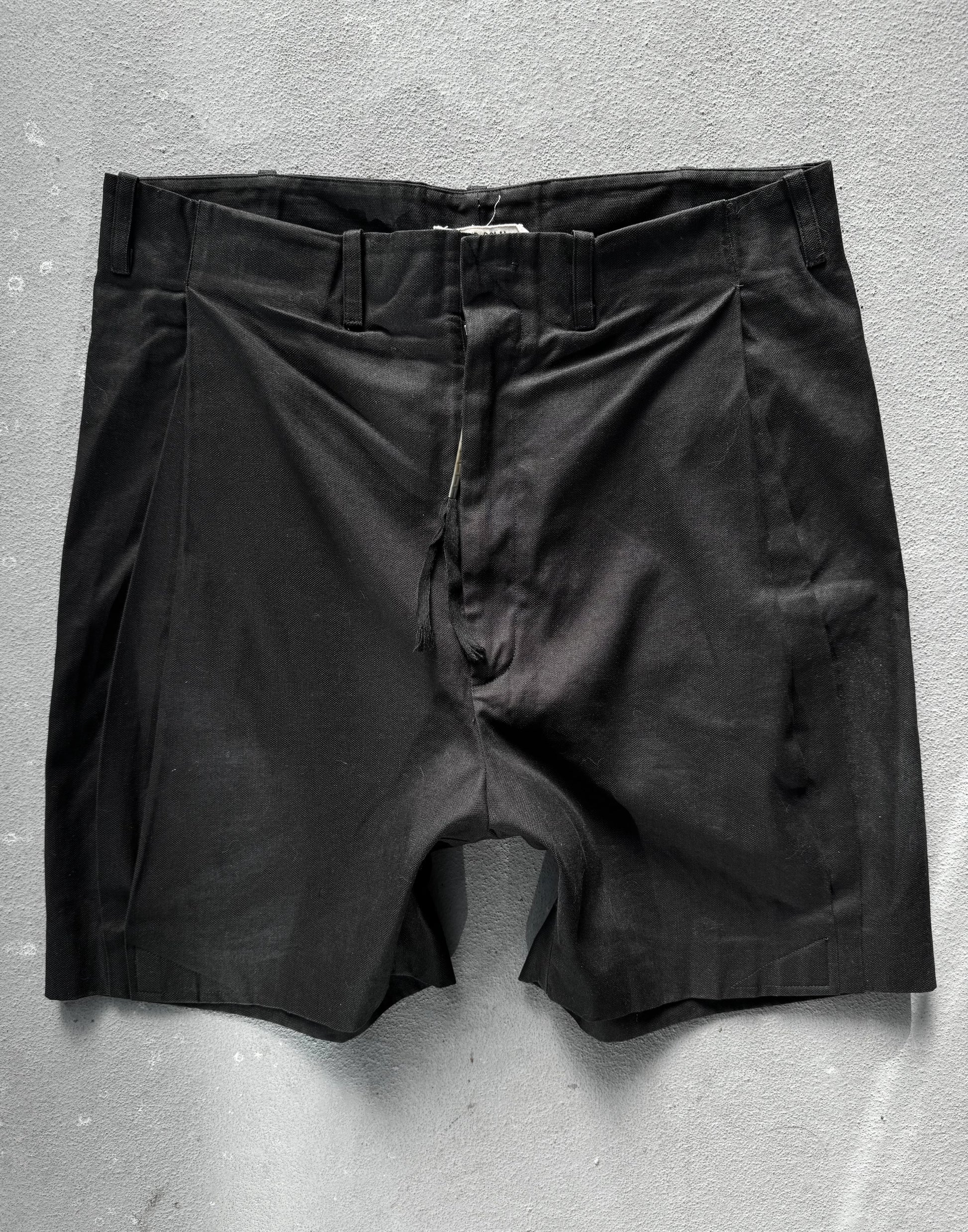 Black shorts on a gray background