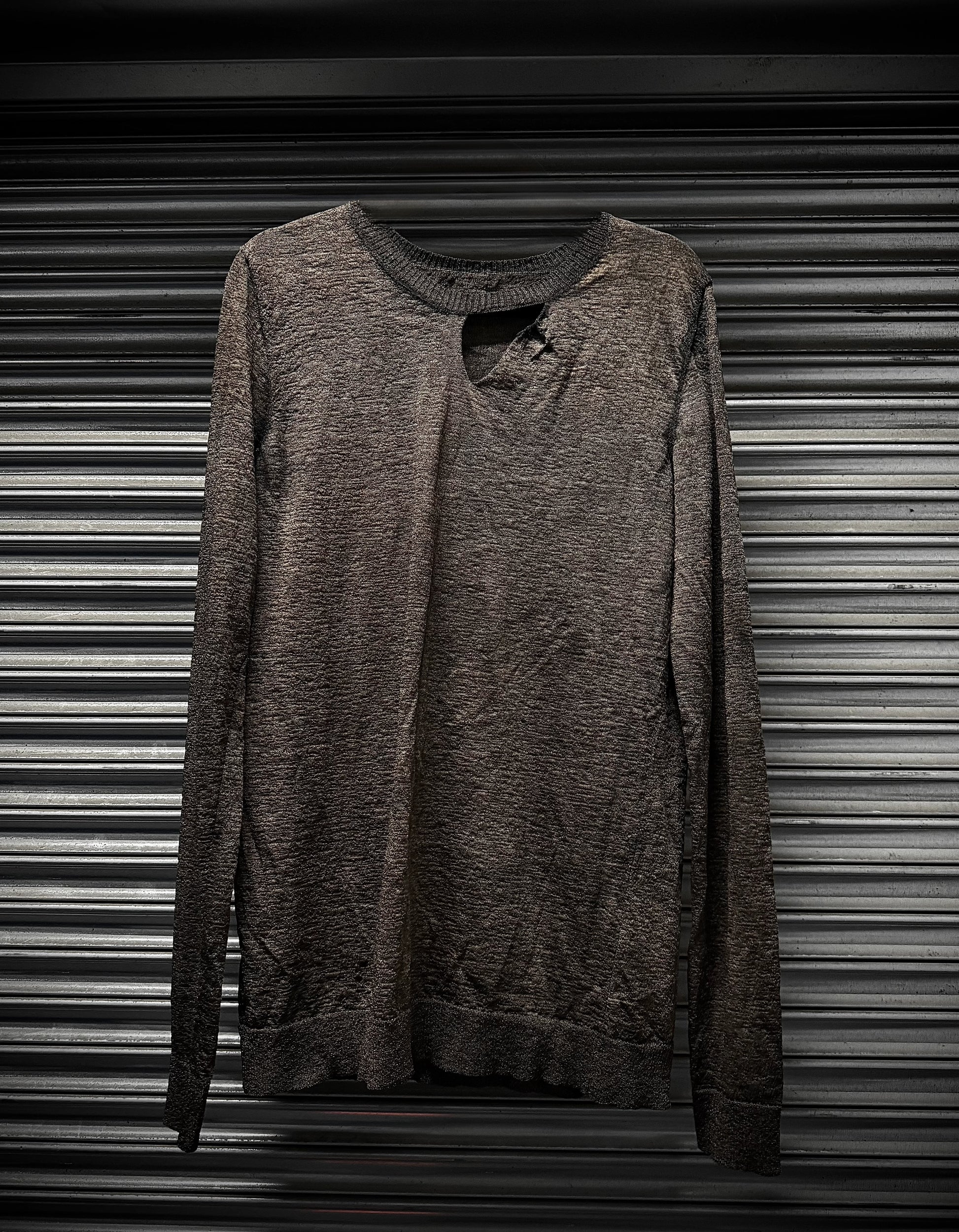 Brown sweatshirt on a metallic surface