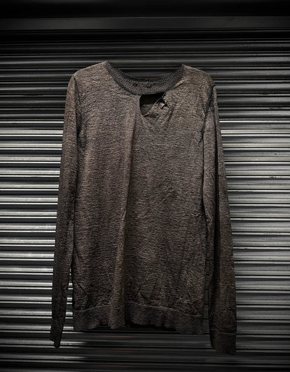 Brown sweatshirt on a metallic surface