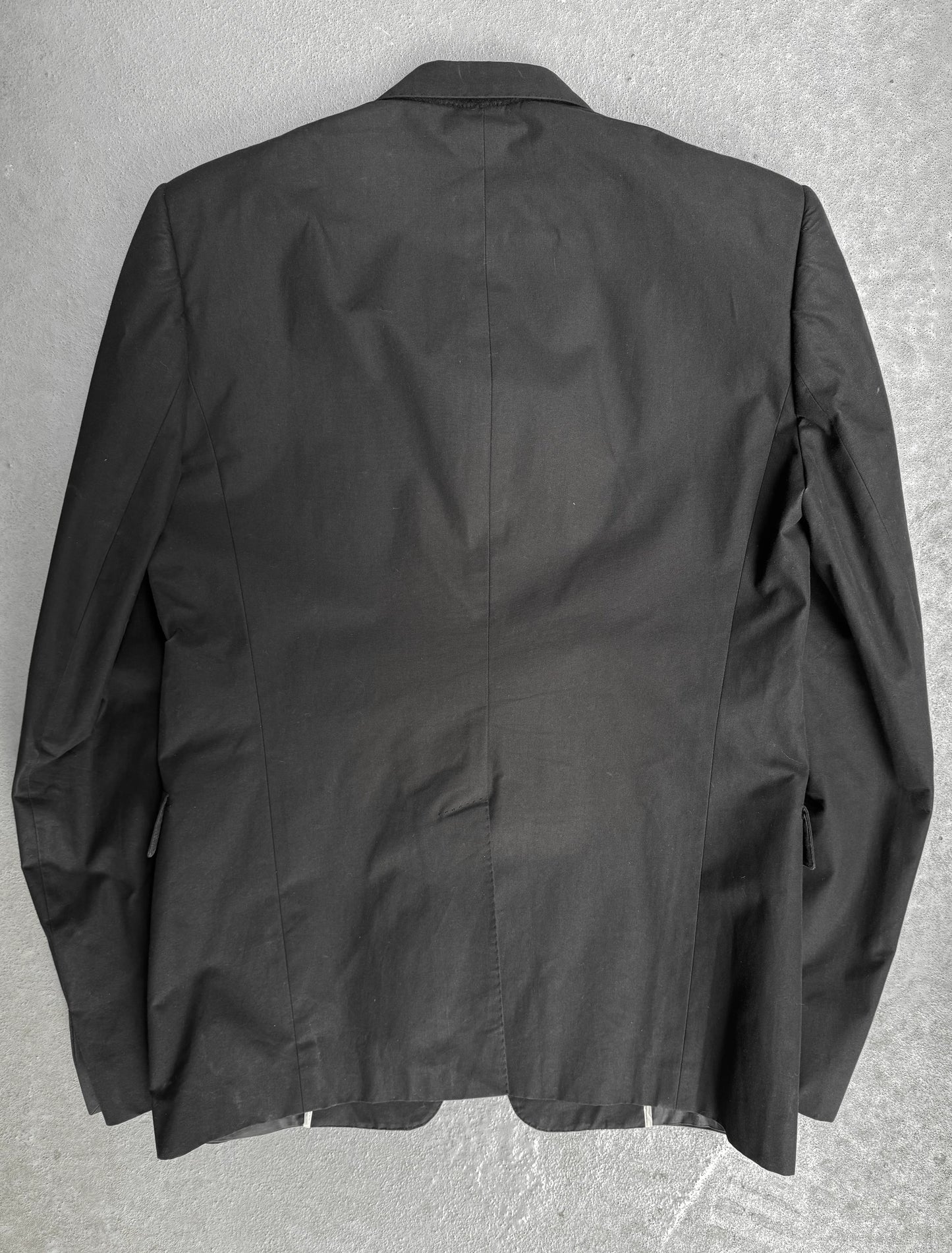 Black jacket on a gray textured background
