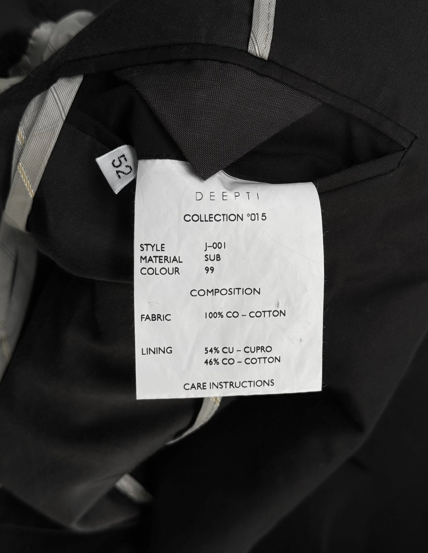 Clothing label with details on a black garment