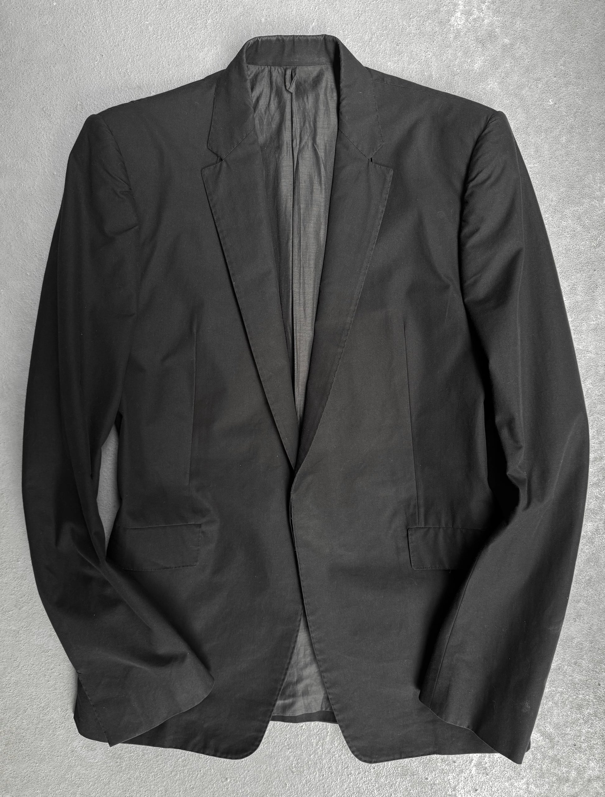 Black blazer on a gray background