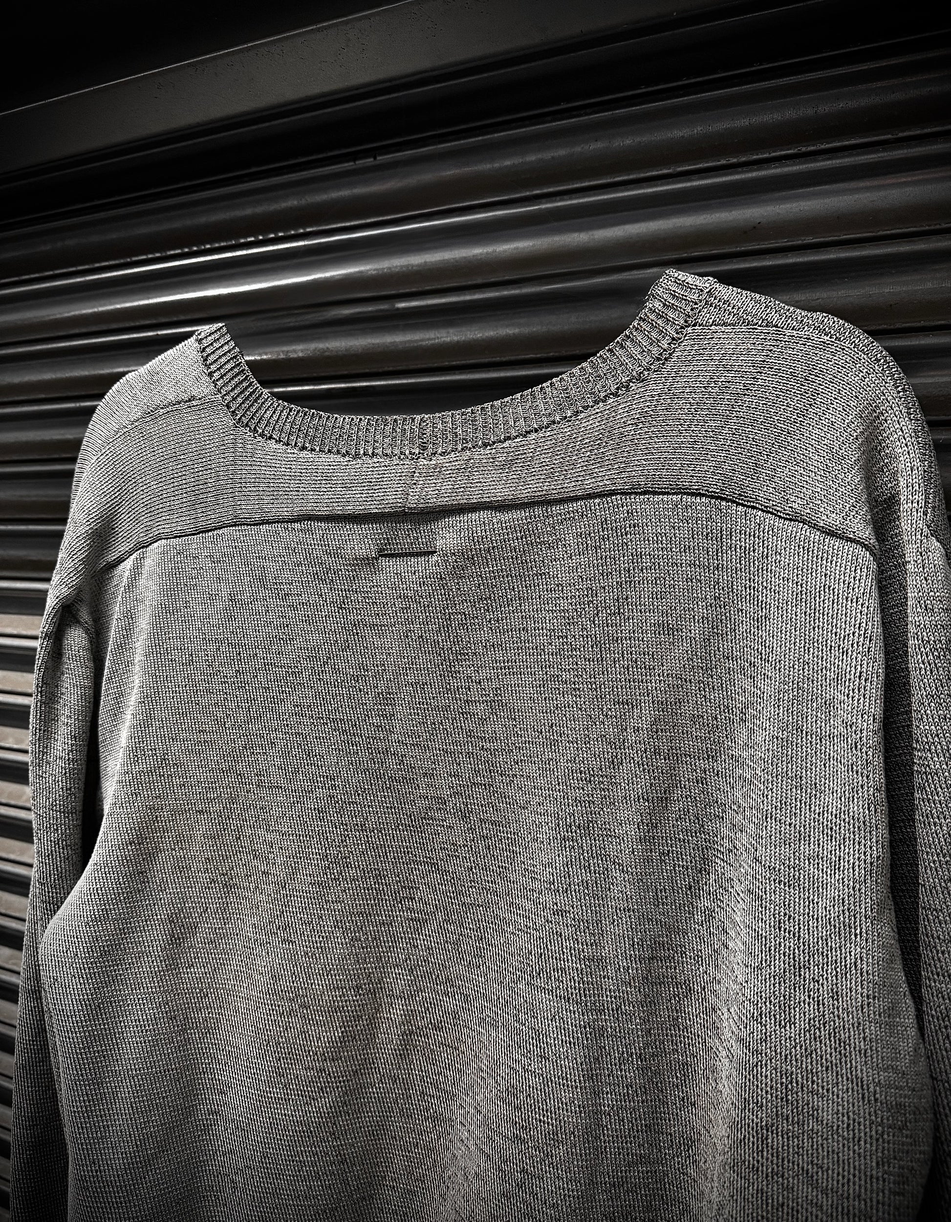 Gray sweater on a black background