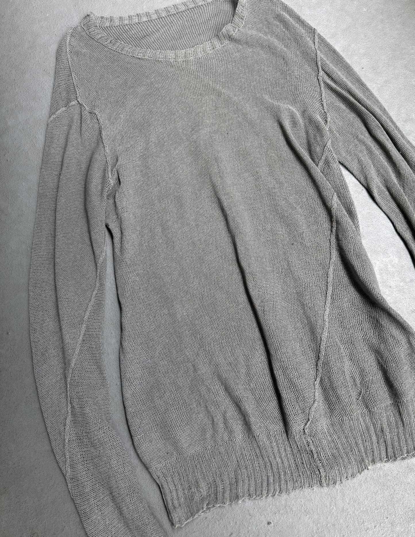 Gray sweater on a gray surface