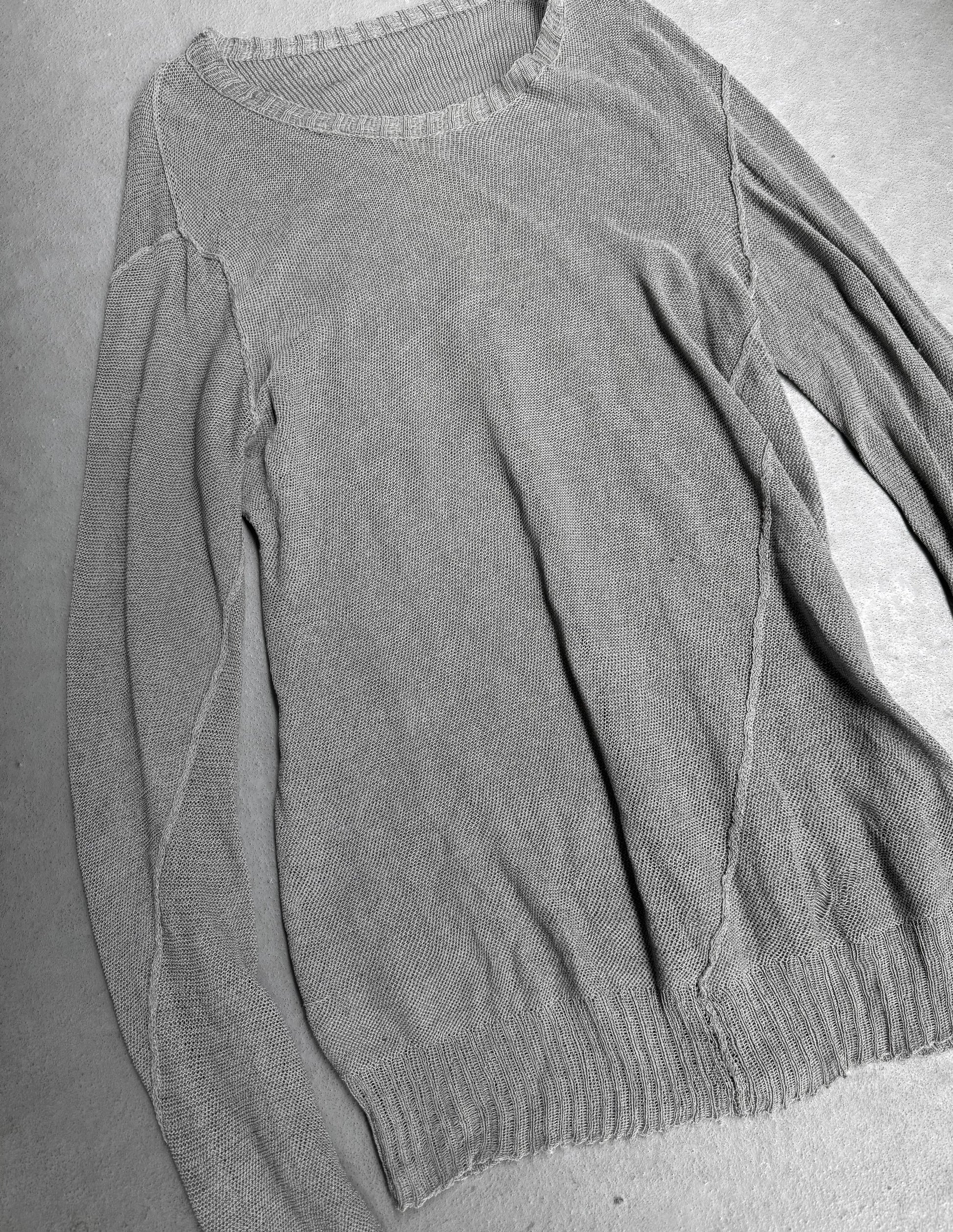 Gray sweater on a gray surface