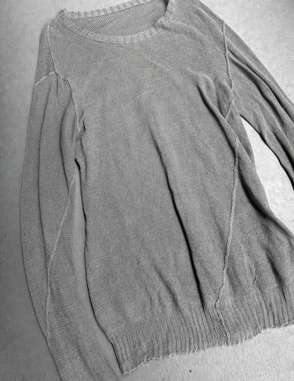 Gray sweater on a gray surface