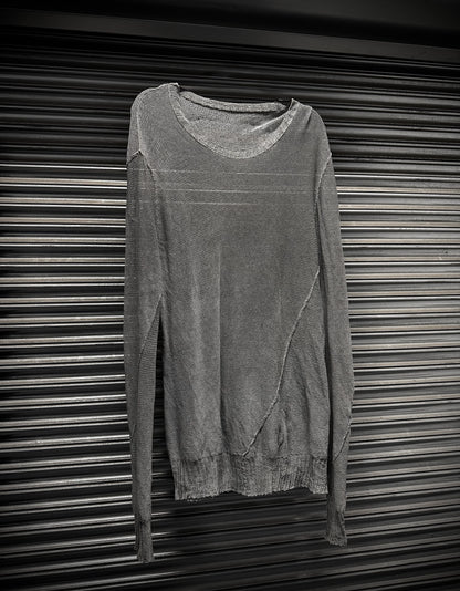 Gray sweater on a metallic surface