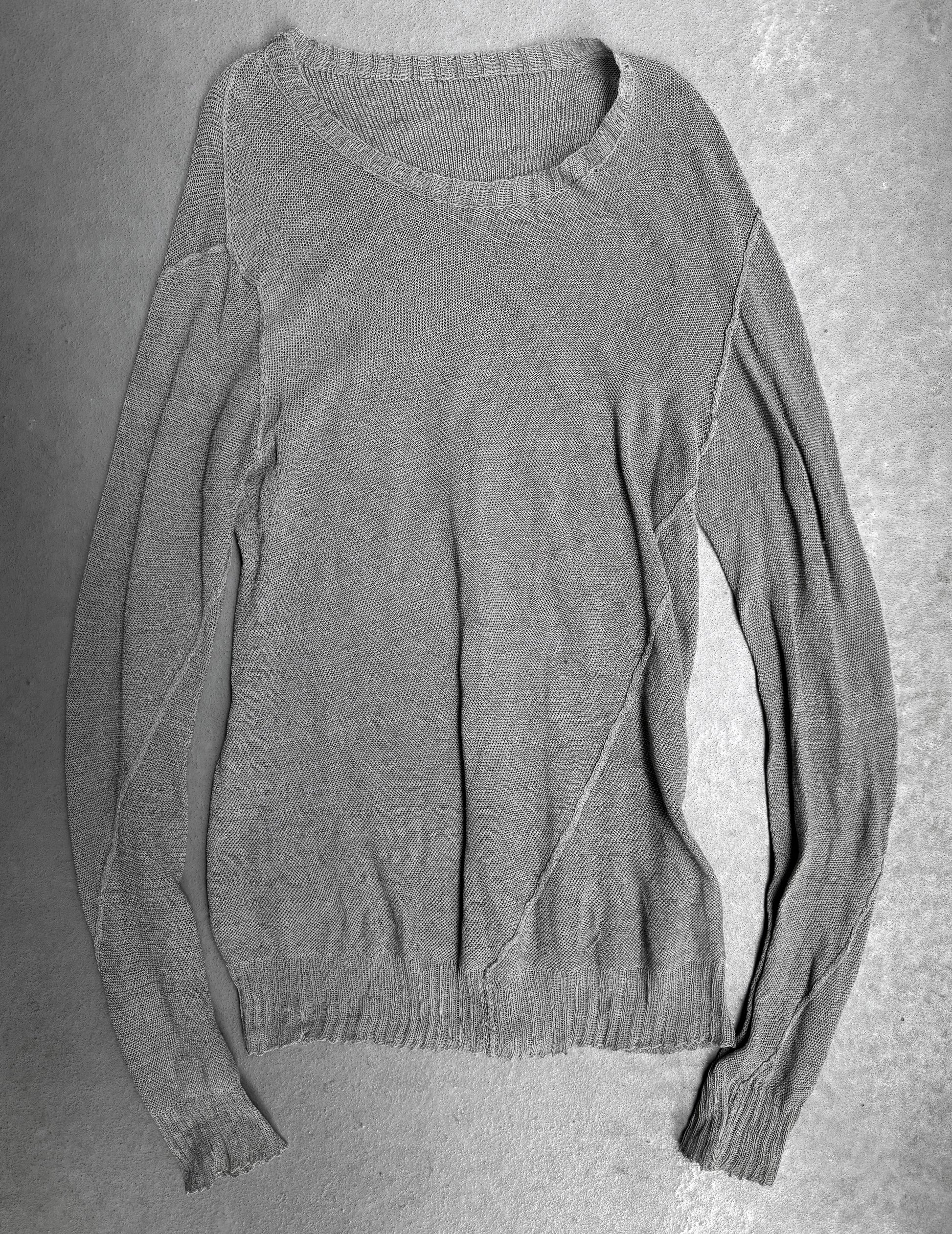 Gray sweater on a textured gray background