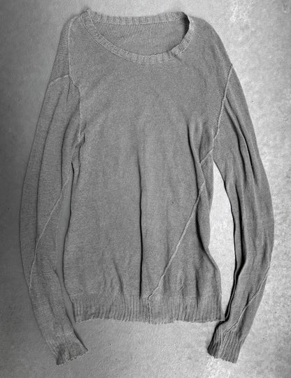Gray sweater on a textured gray background