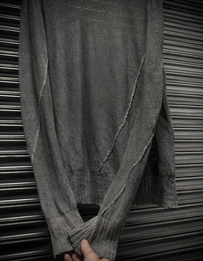 Gray textured fabric draped over a metallic surface