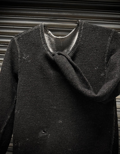 Dark gray coat with a textured texture against a neutral background