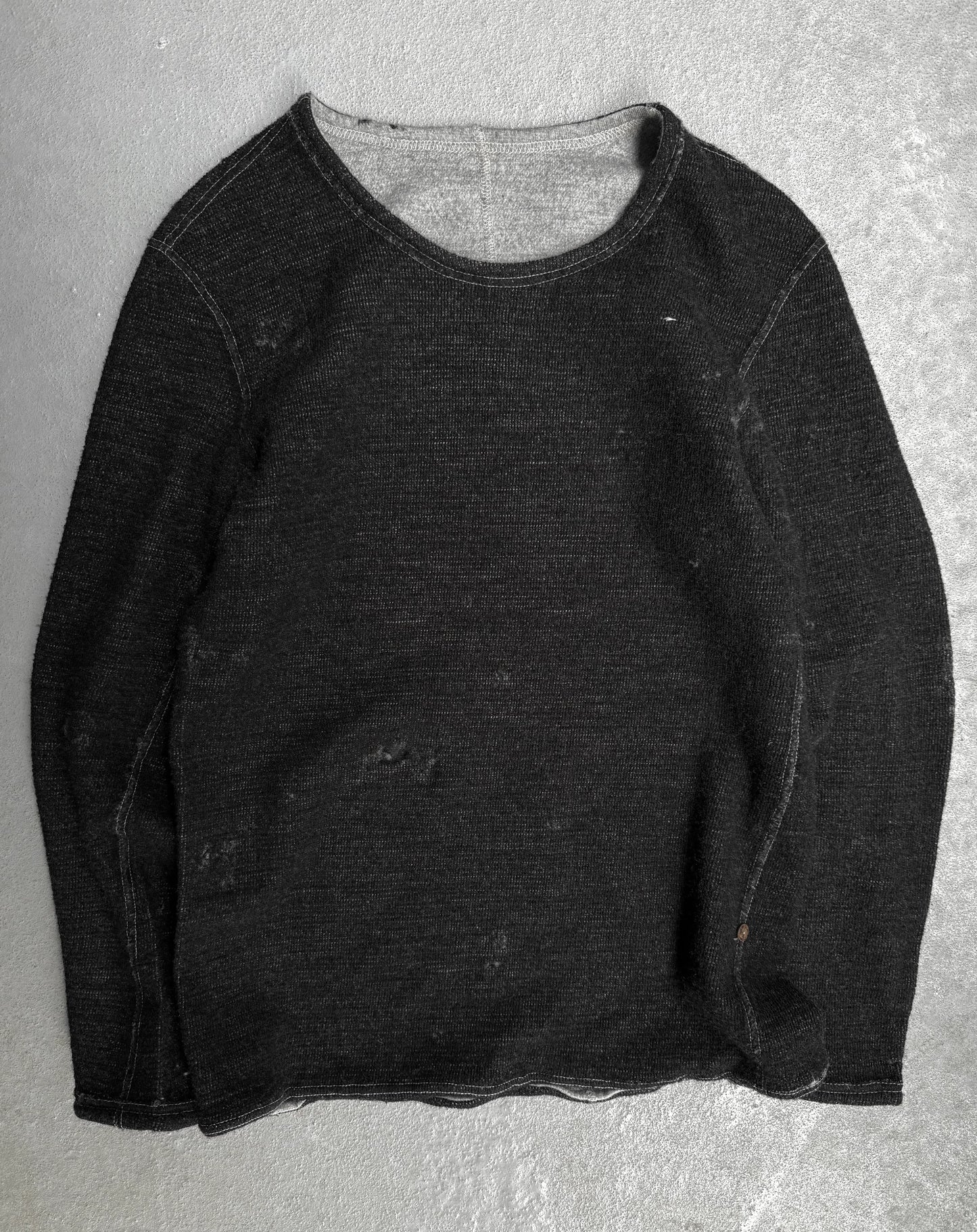 Dark gray long-sleeve shirt on a light gray background