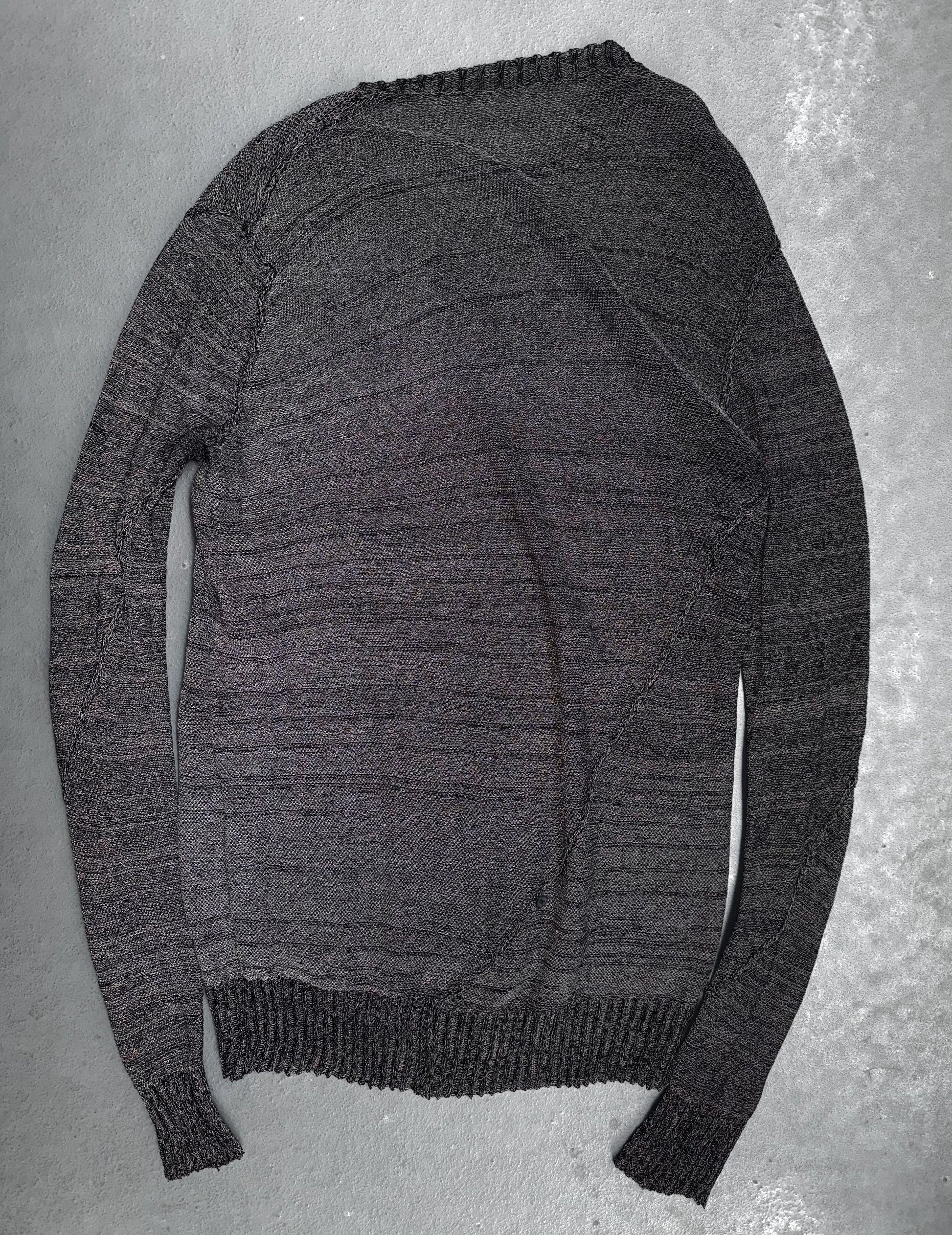 Gray sweater on a textured gray background