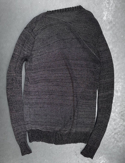 Gray sweater on a textured gray background