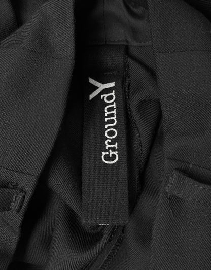 Close-up of a black jacket with 'GroundY' logo on a dark background