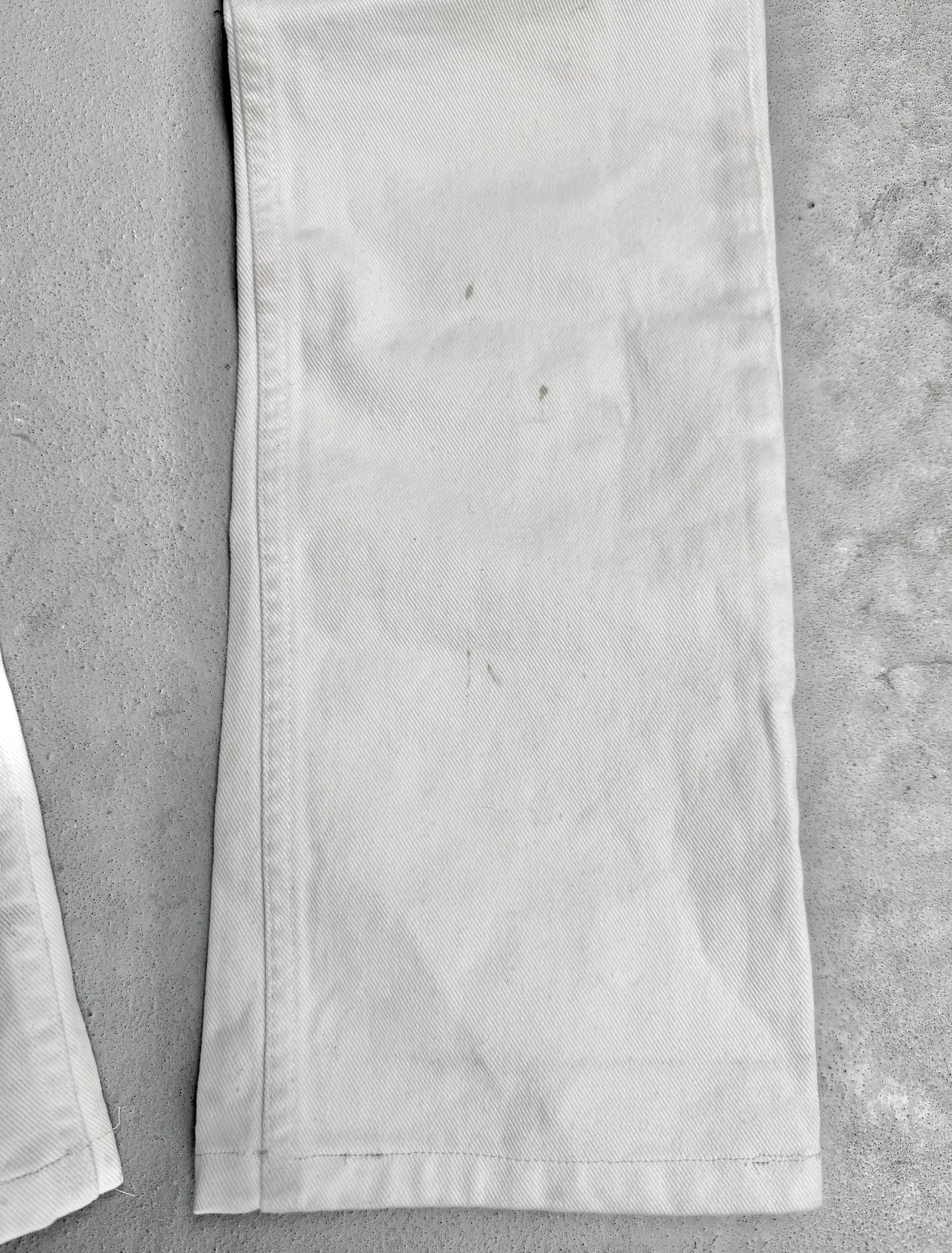 Close-up of a white fabric strip on a gray surface