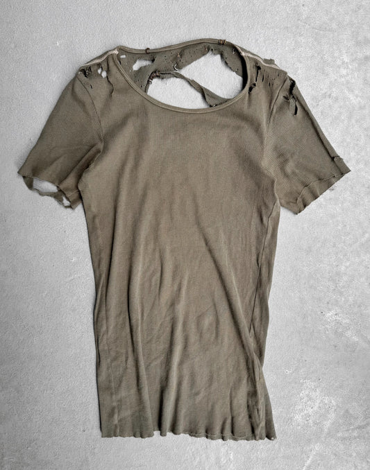 Ripped brown t-shirt on a textured gray background