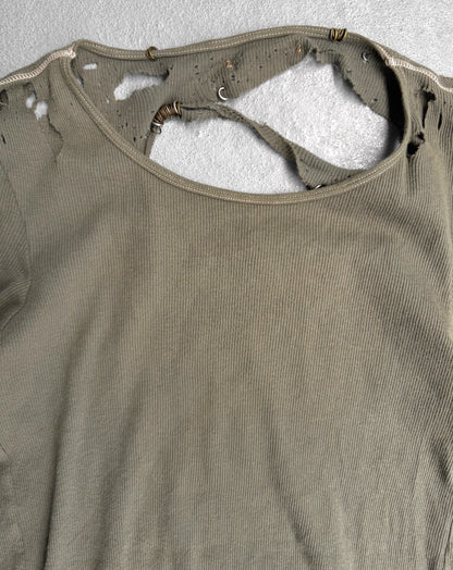 Brown tank top with visible wear and tear on a textured gray background