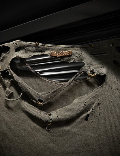 Close-up of a black metal object on a textured surface