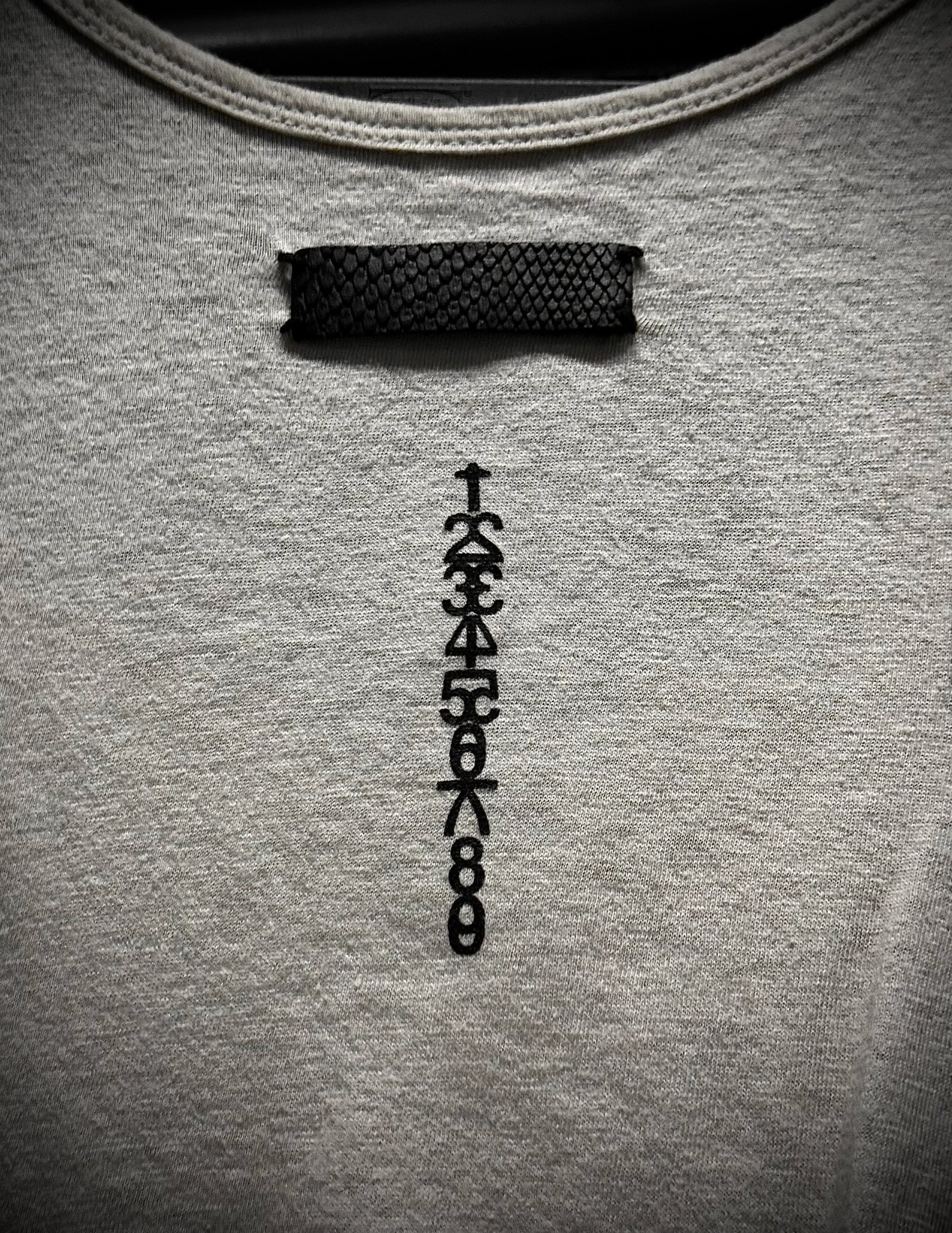 Gray sweatshirt with a black embroidered design on the chest.