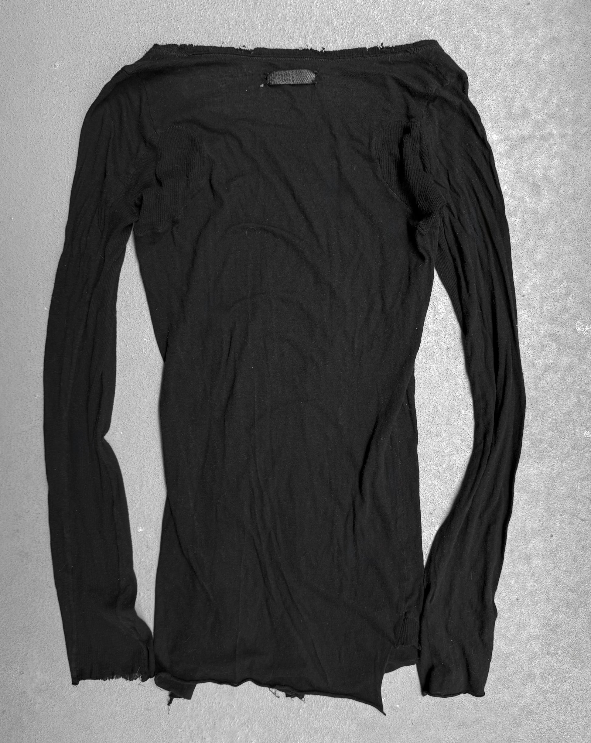 Black long-sleeve shirt on a gray background