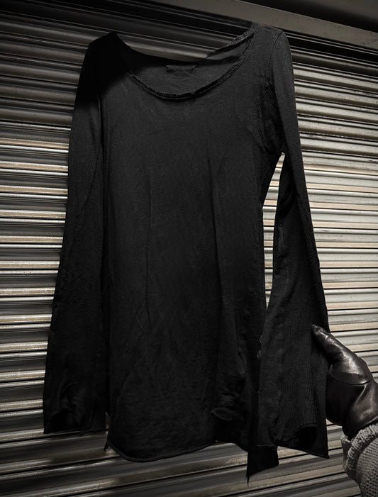 Black long-sleeve top with a hood on a striped background