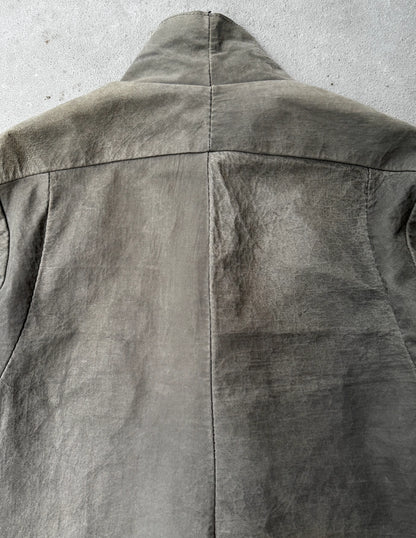 Close-up of a gray jacket on a concrete surface