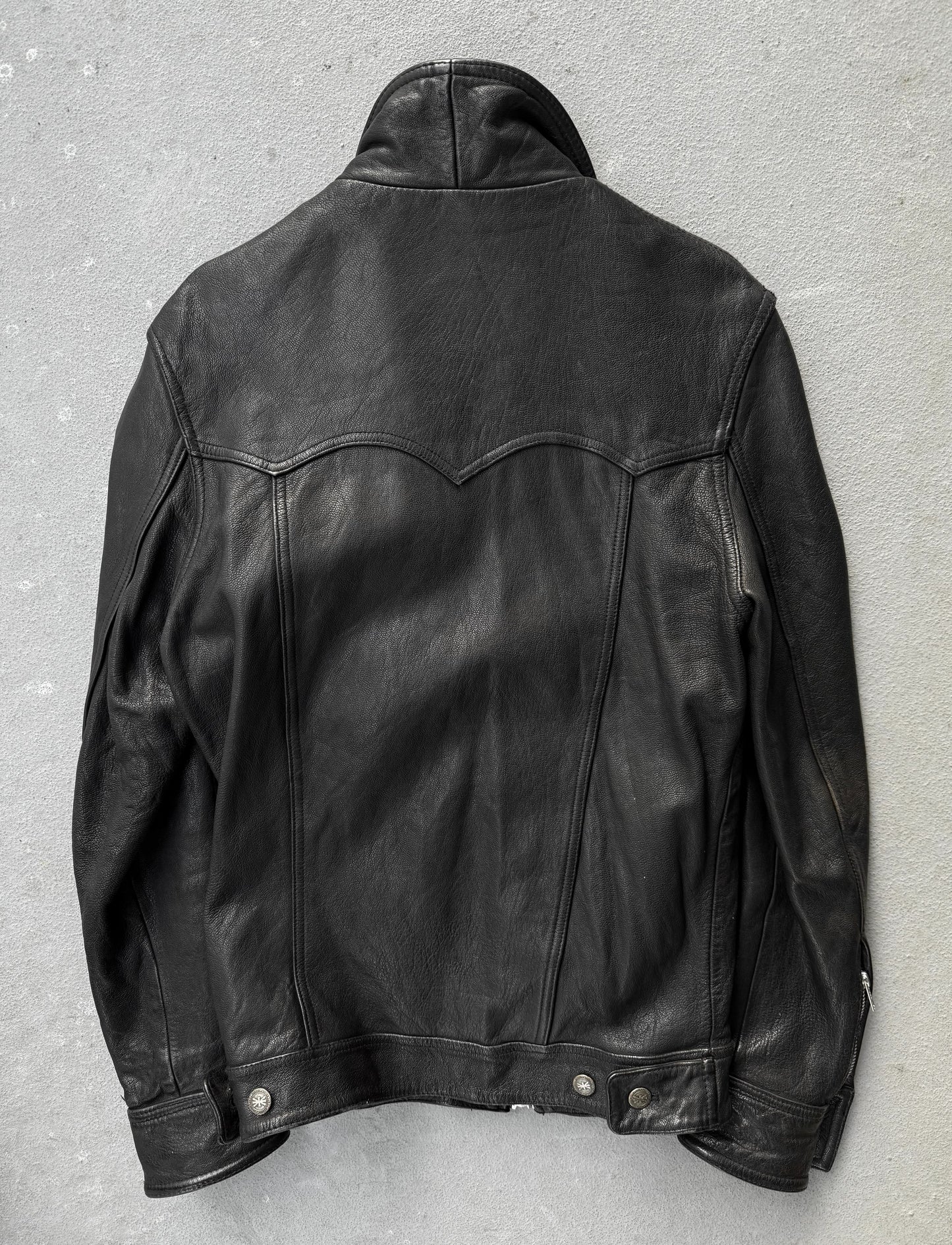 Black leather jacket on a gray background