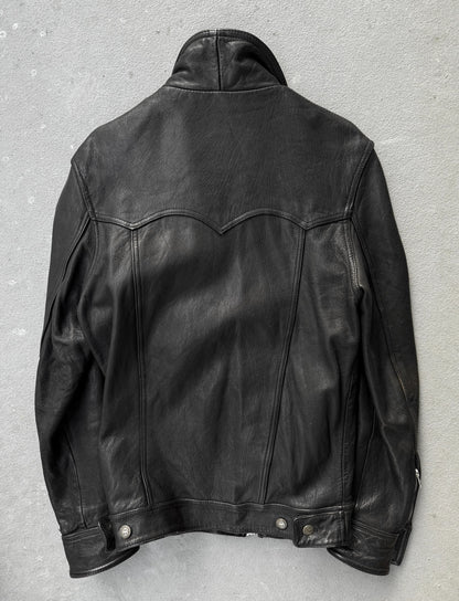 Black leather jacket on a gray background