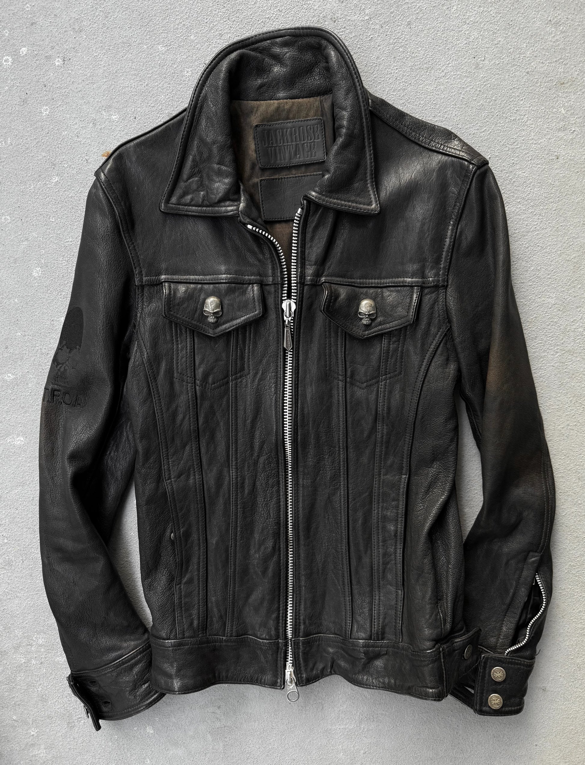 Black leather jacket on a gray background