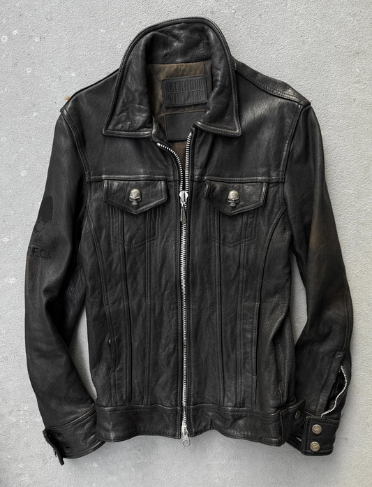 Black leather jacket on a gray background