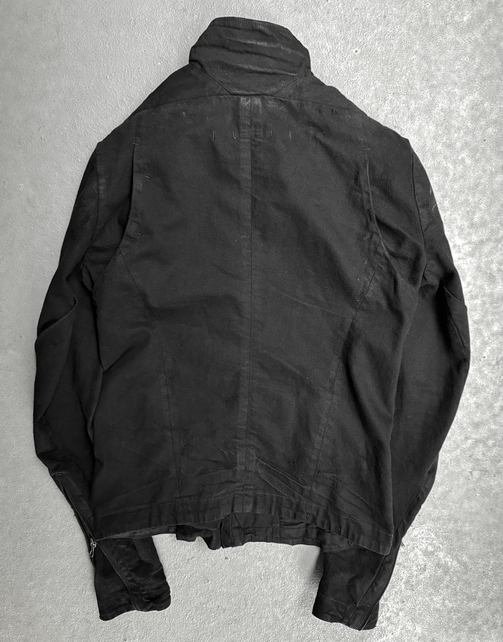 Black jacket on a textured gray surface